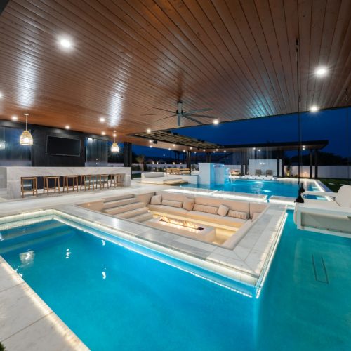 Custom pool and backyard on Warbler Road in Gilbert, AZ by Envy Pools