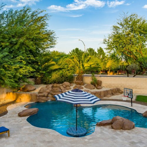 Aerial view of custom freeform pool and backyard on Lobo Avenue in Mesa, AZ by Envy Pools