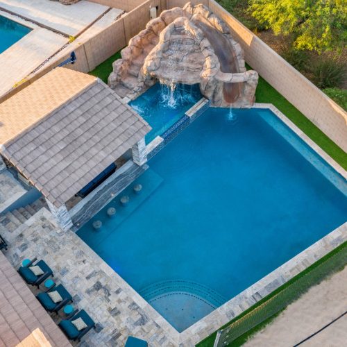 Aerial overhead pool and rock grotto at a Queen Creek, AZ home