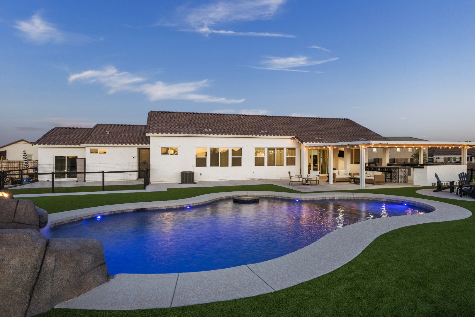 Custom pool with rock waterslide on Paoli Street in Queen Creek, AZ by Envy Pools