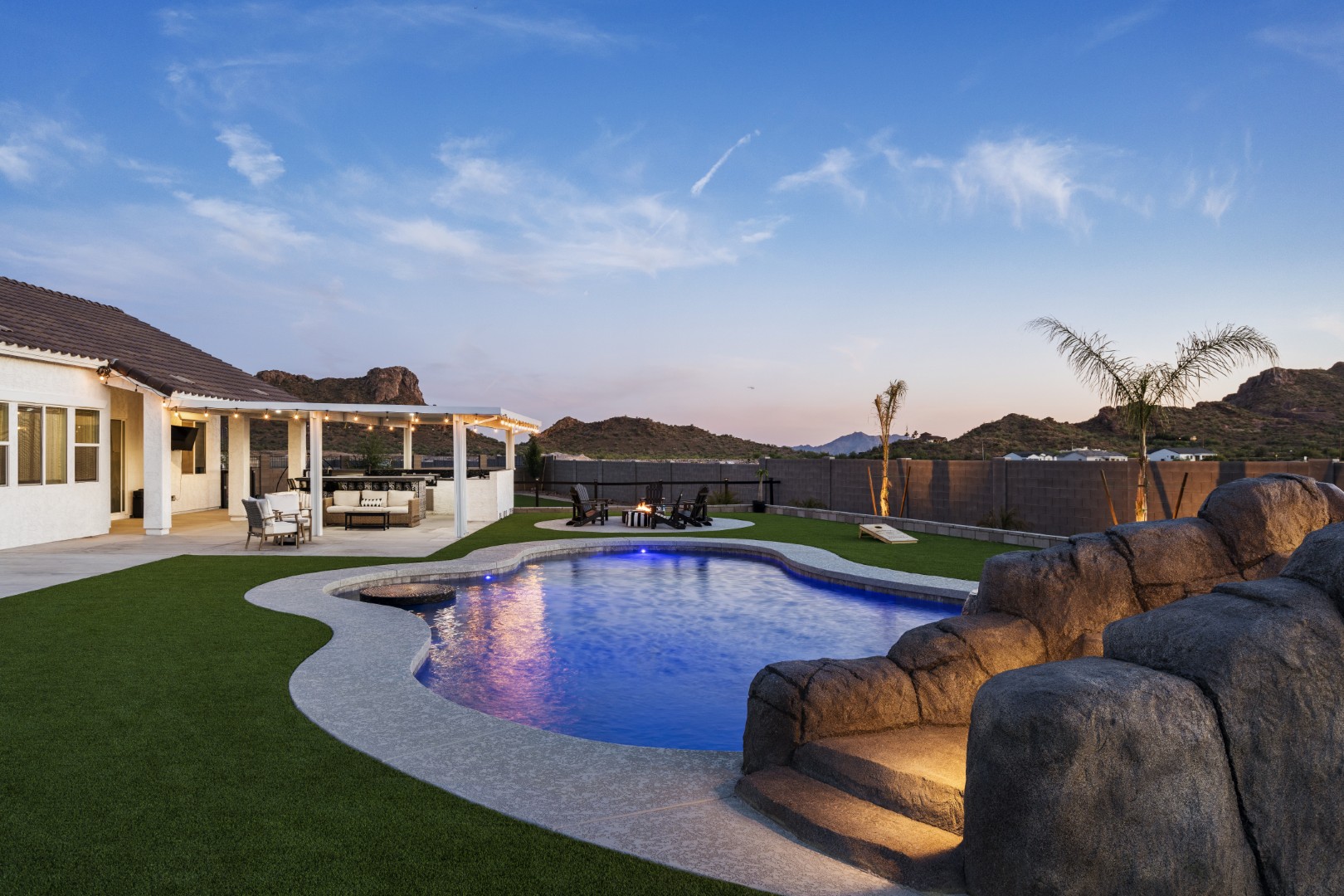 Custom pool with rock waterslide on Paoli Street in Queen Creek, AZ by Envy Pools