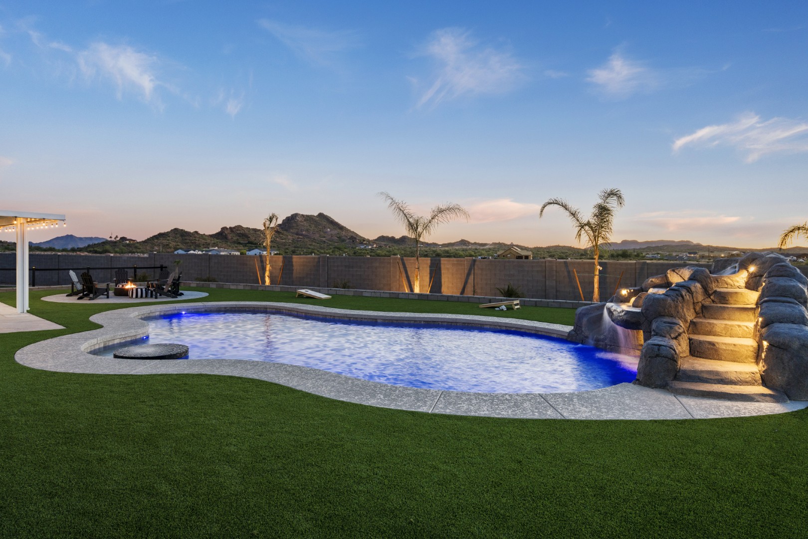 Custom pool with rock waterslide on Paoli Street in Queen Creek, AZ by Envy Pools