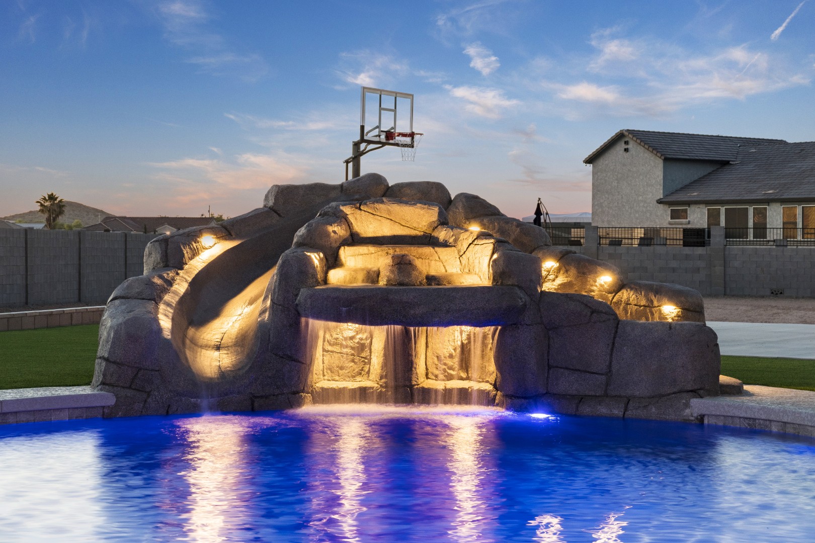 Custom pool with rock waterslide on Paoli Street in Queen Creek, AZ by Envy Pools