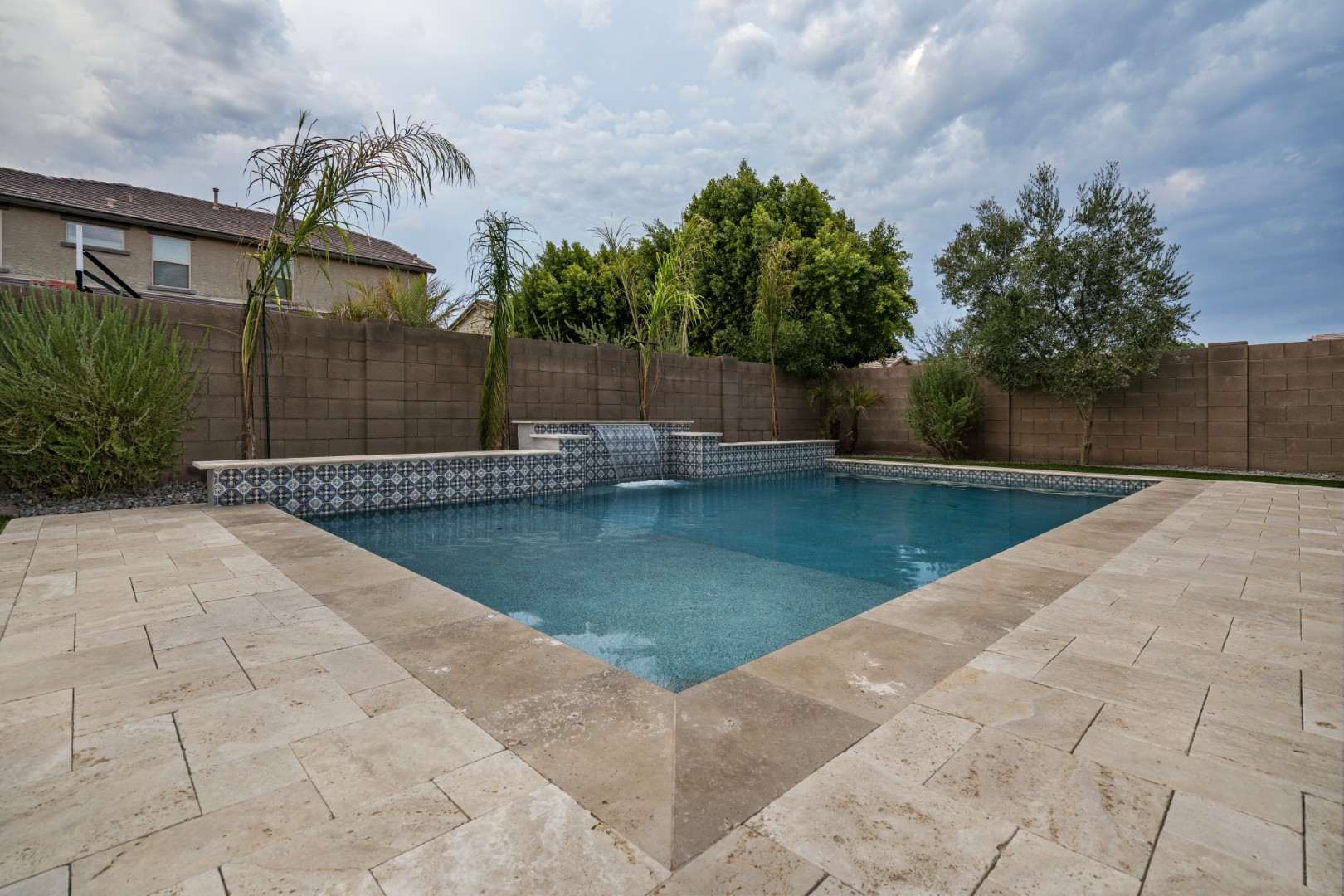Custom pool and waterfall design on Marlene Drive in Gilbert, AZ by Envy Pools
