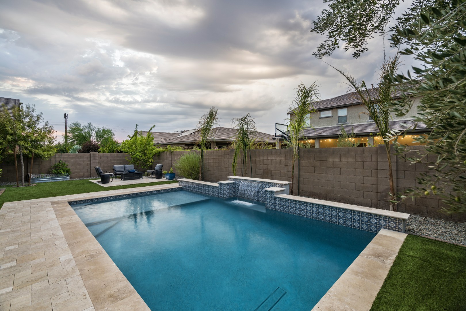 Custom pool and waterfall design on Marlene Drive in Gilbert, AZ by Envy Pools
