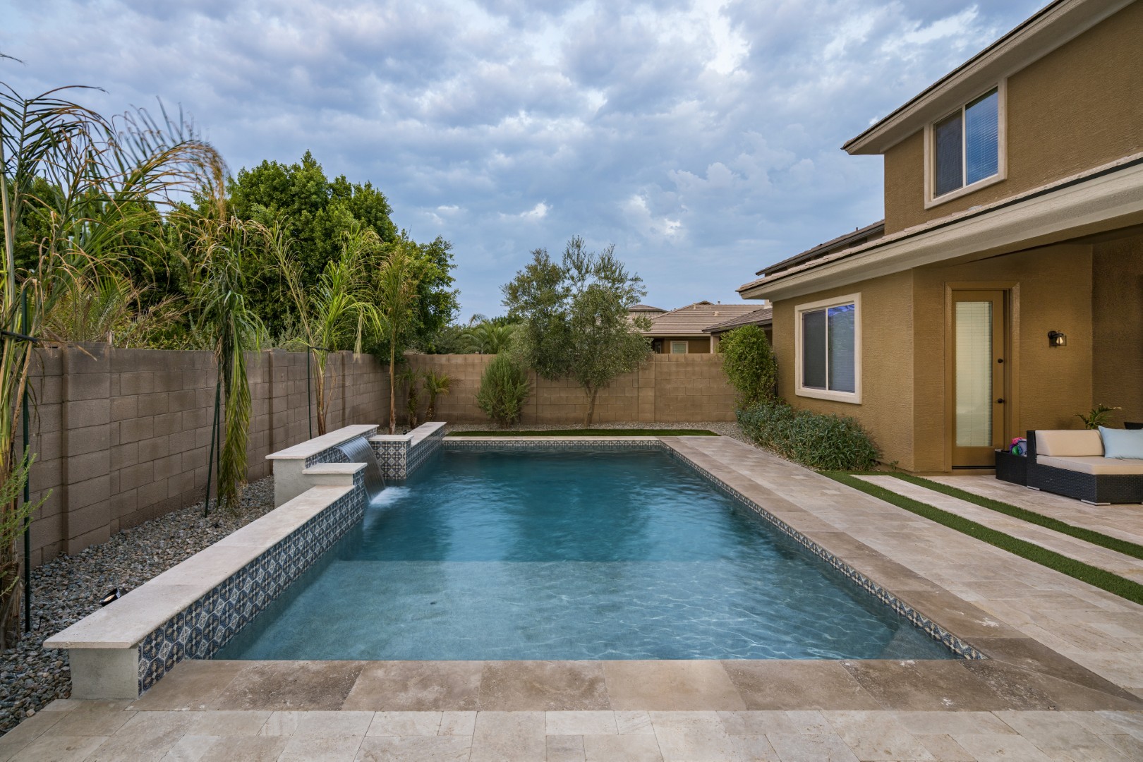 Custom pool and waterfall design on Marlene Drive in Gilbert, AZ by Envy Pools