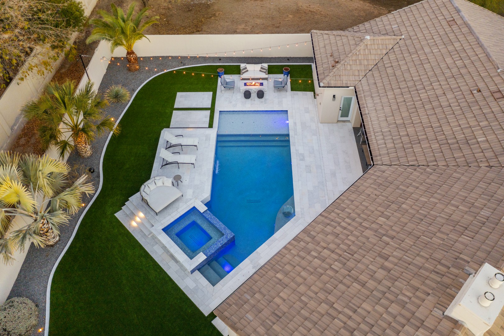 Custom geometric pool with raised spa and putting green in Scottsdale, AZ by Envy Pools