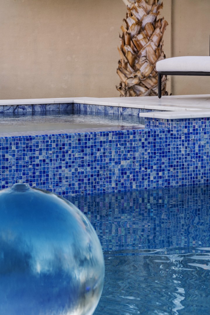 Custom geometric pool with raised spa and putting green in Scottsdale, AZ by Envy Pools