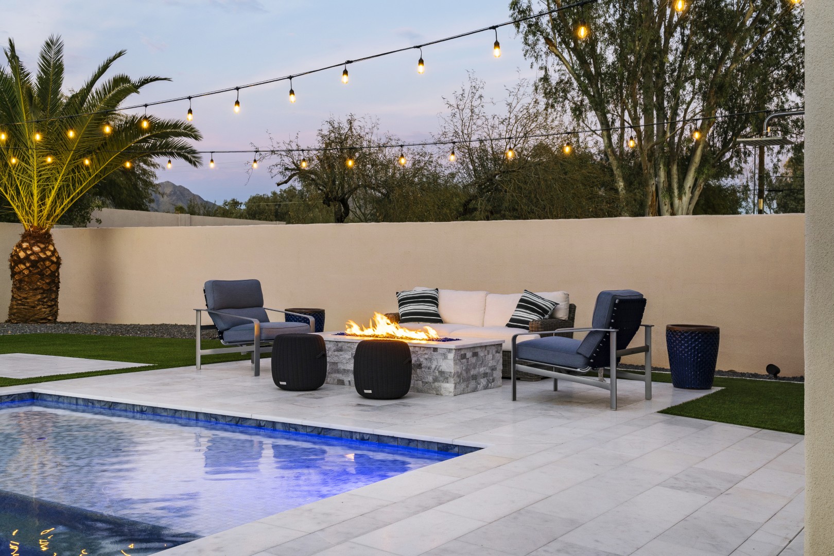 Custom geometric pool with raised spa and putting green in Scottsdale, AZ by Envy Pools