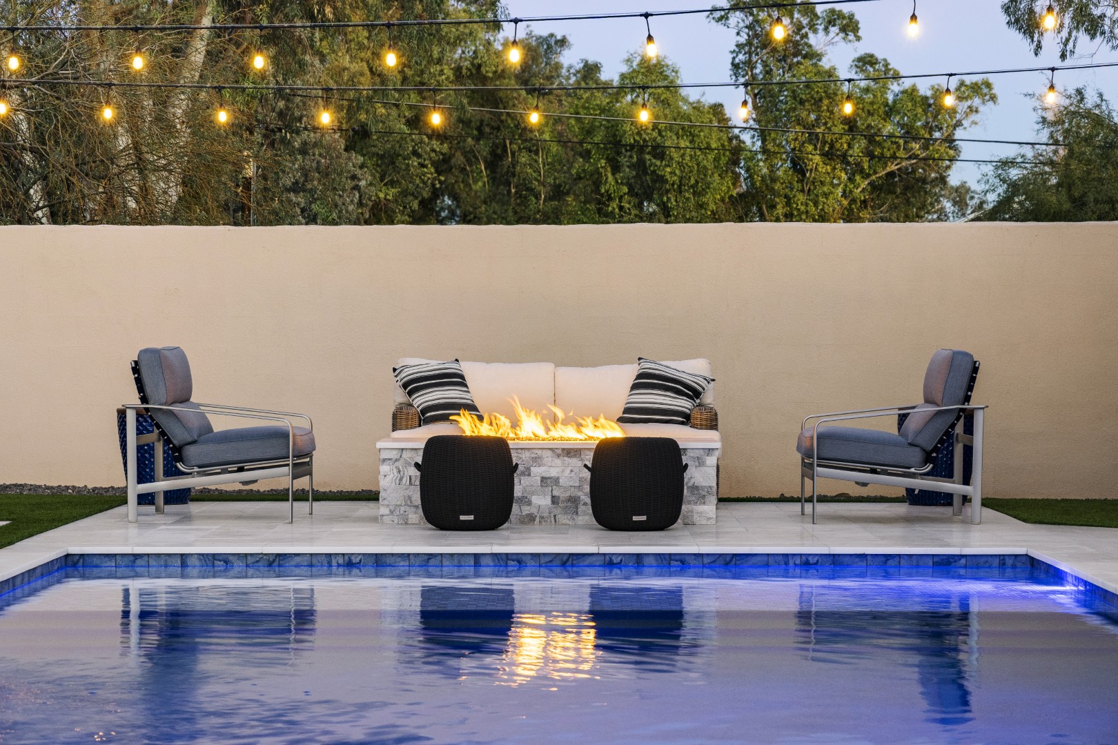 Custom geometric pool with raised spa and putting green in Scottsdale, AZ by Envy Pools