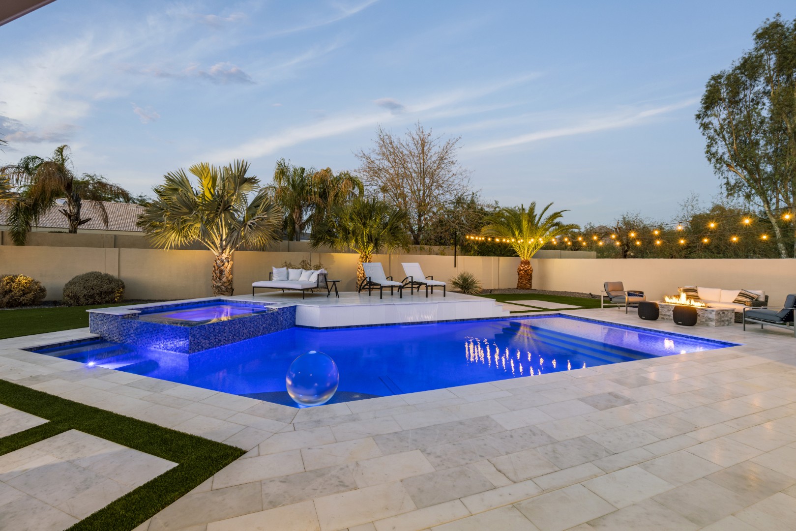 Custom geometric pool with raised spa and putting green in Scottsdale, AZ by Envy Pools