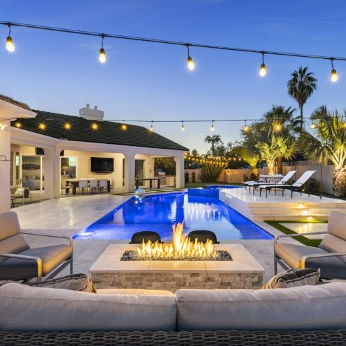 Custom geometric pool with raised spa and putting green in Scottsdale, AZ by Envy Pools
