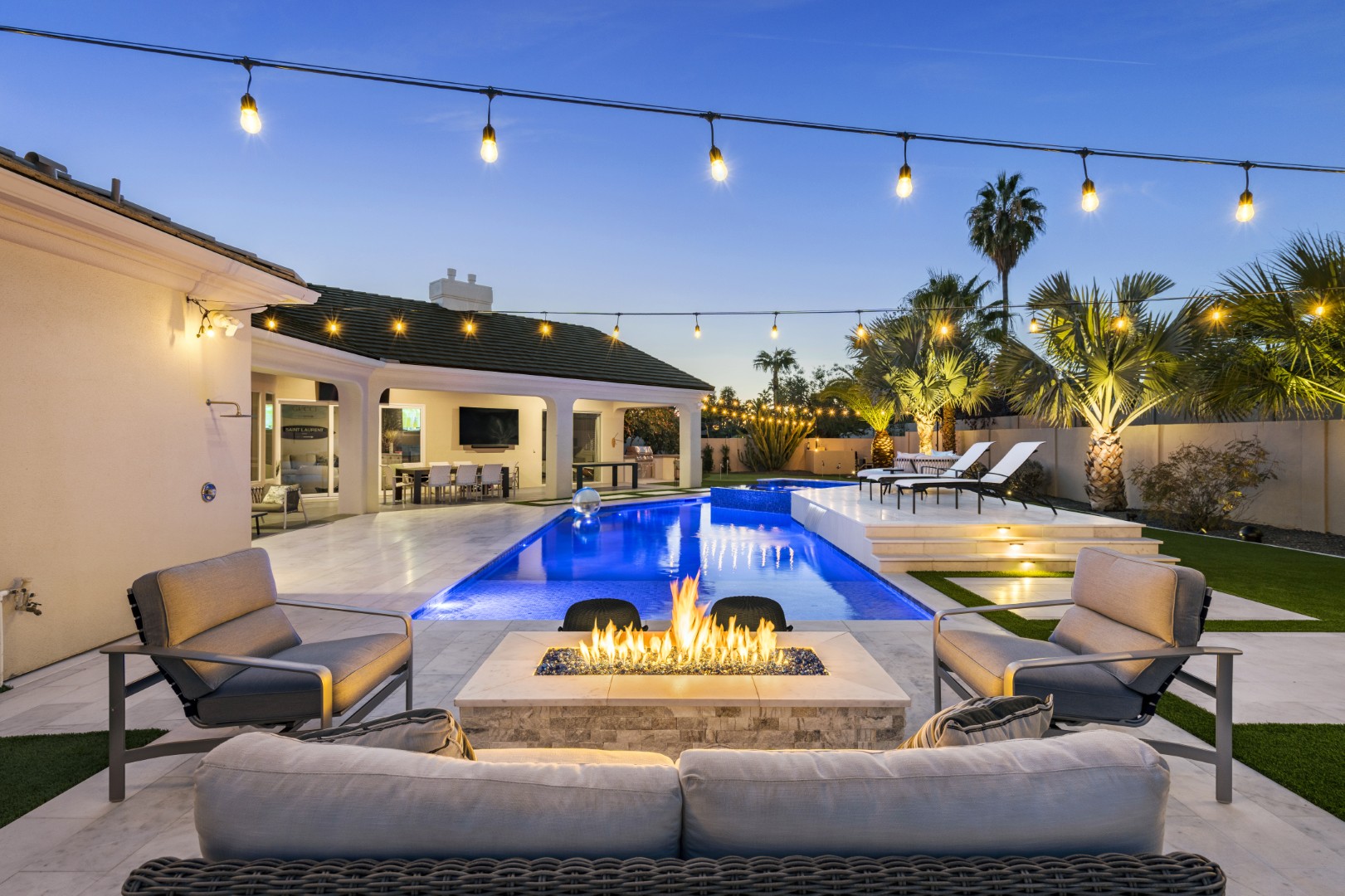 Custom geometric pool with raised spa and putting green in Scottsdale, AZ by Envy Pools