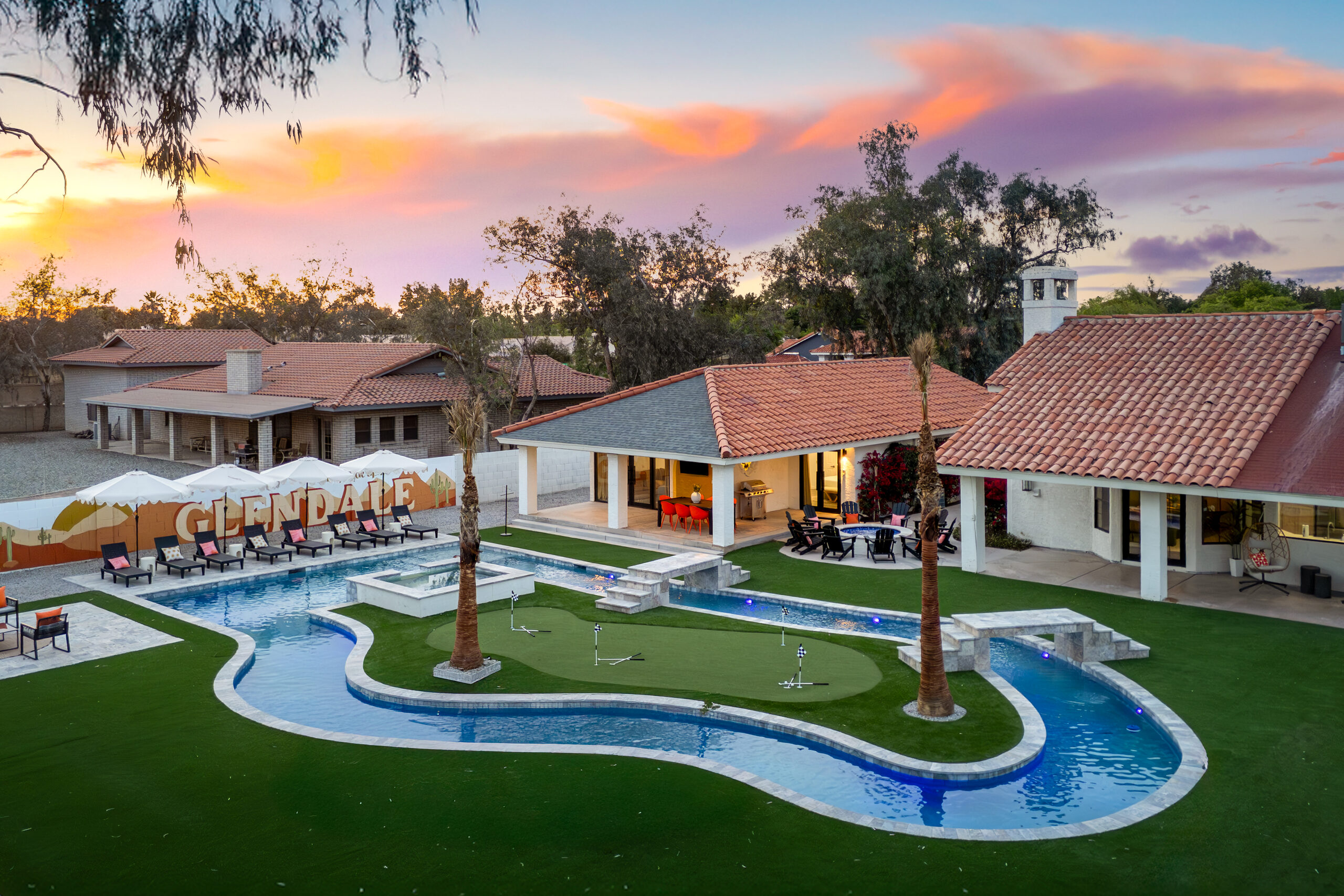 Lazy river wrapping a putting green at sunset in Glendale, AZ