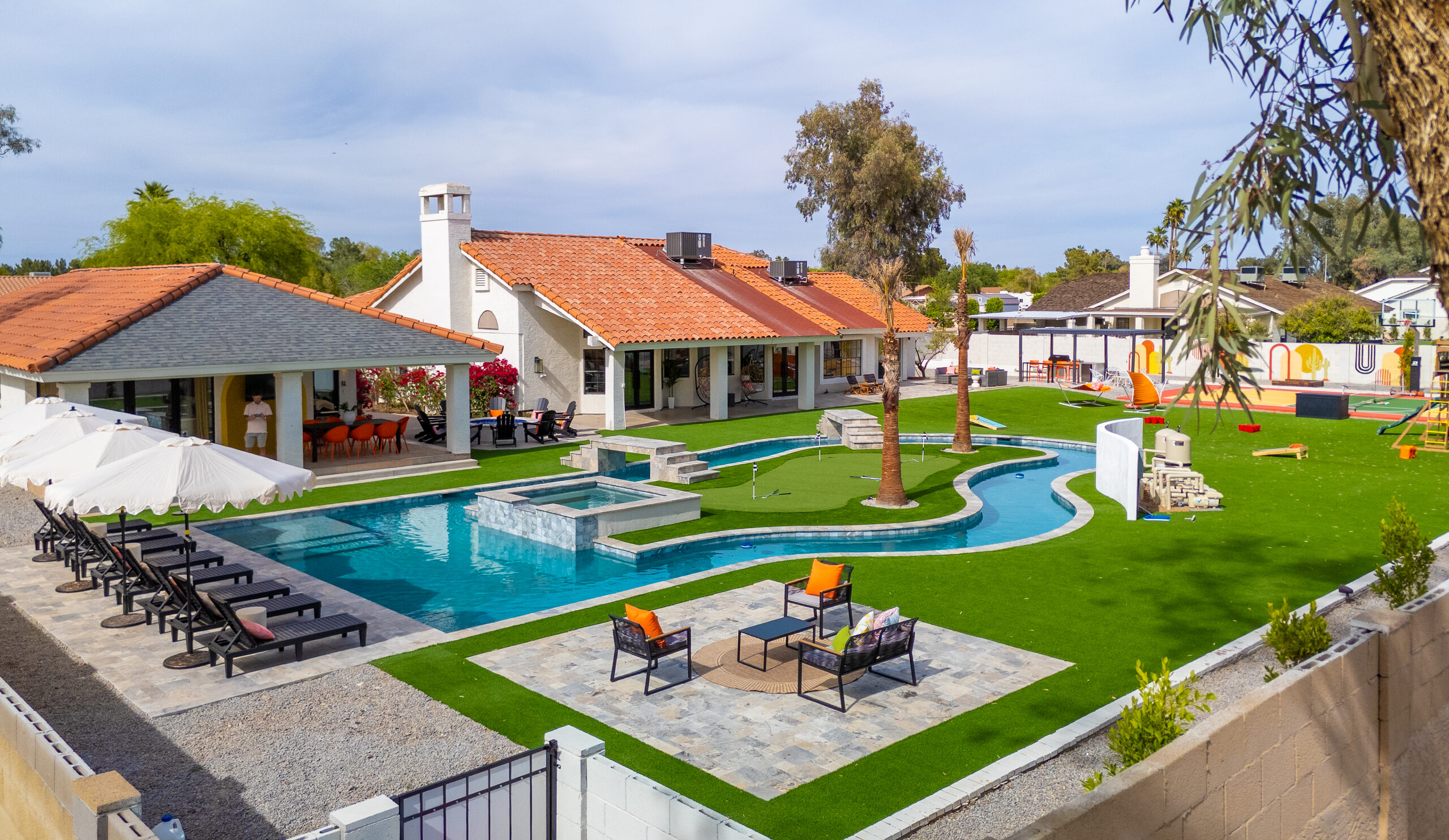 Resort style backyard with lazy river and cabana seating in Glendale, AZ