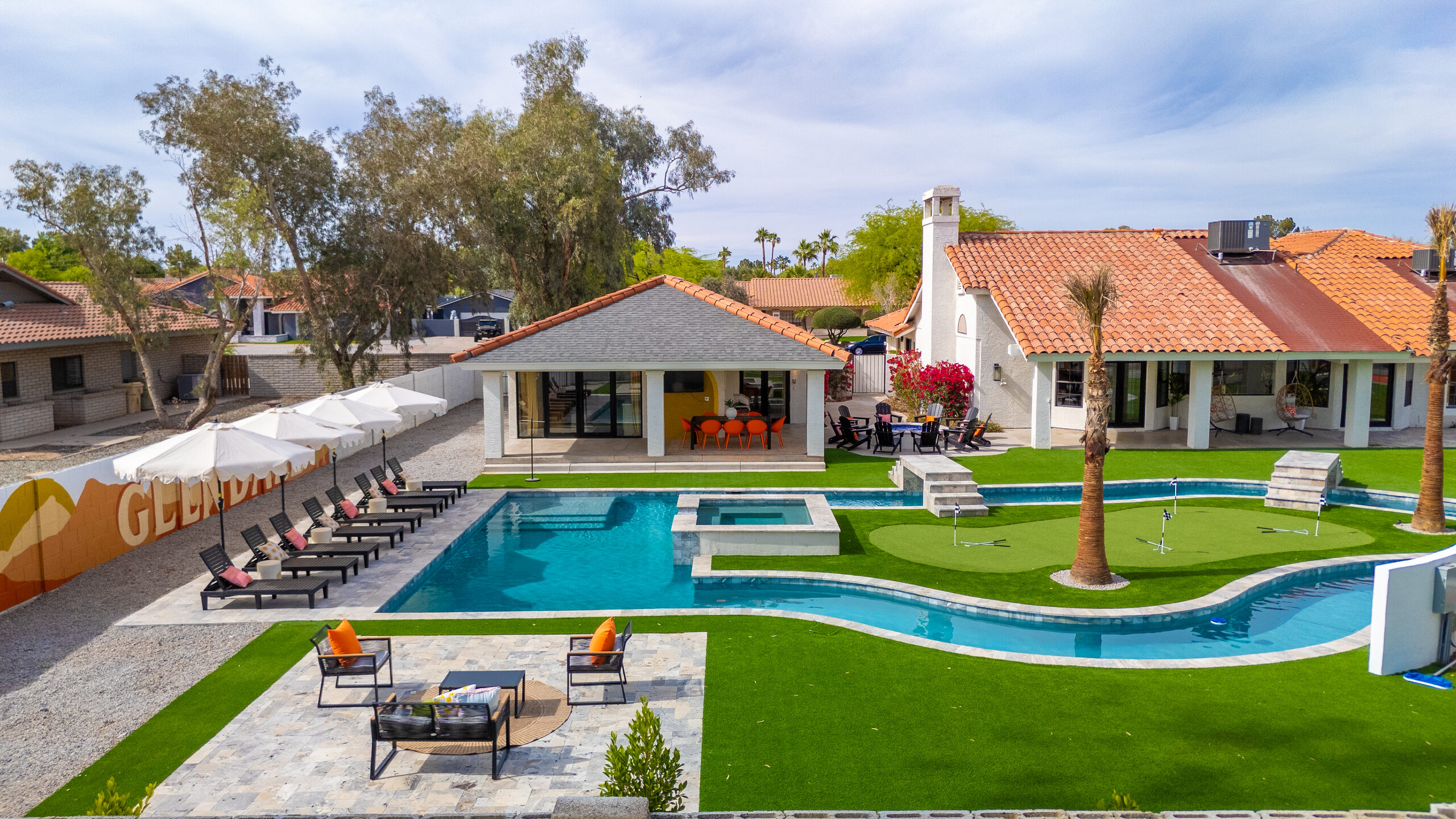 Wide view of a lazy river and pool with cabanas in Glendale, AZ