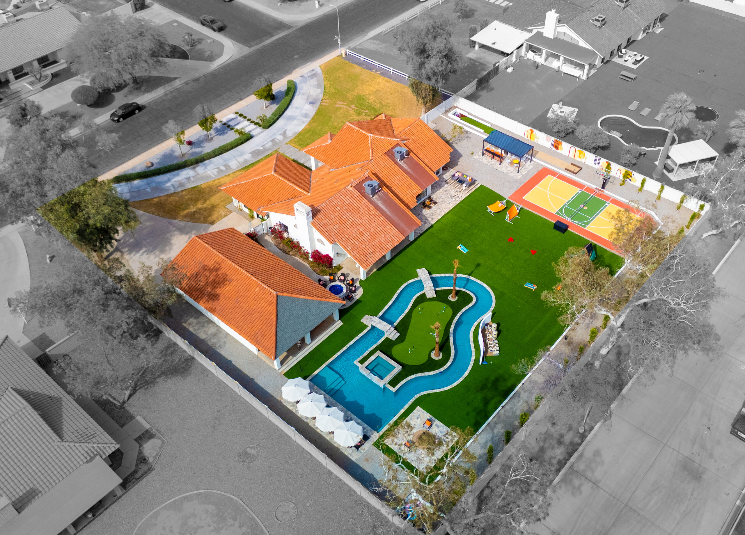 Aerial view of the full lazy river and sport court layout in Glendale, AZ