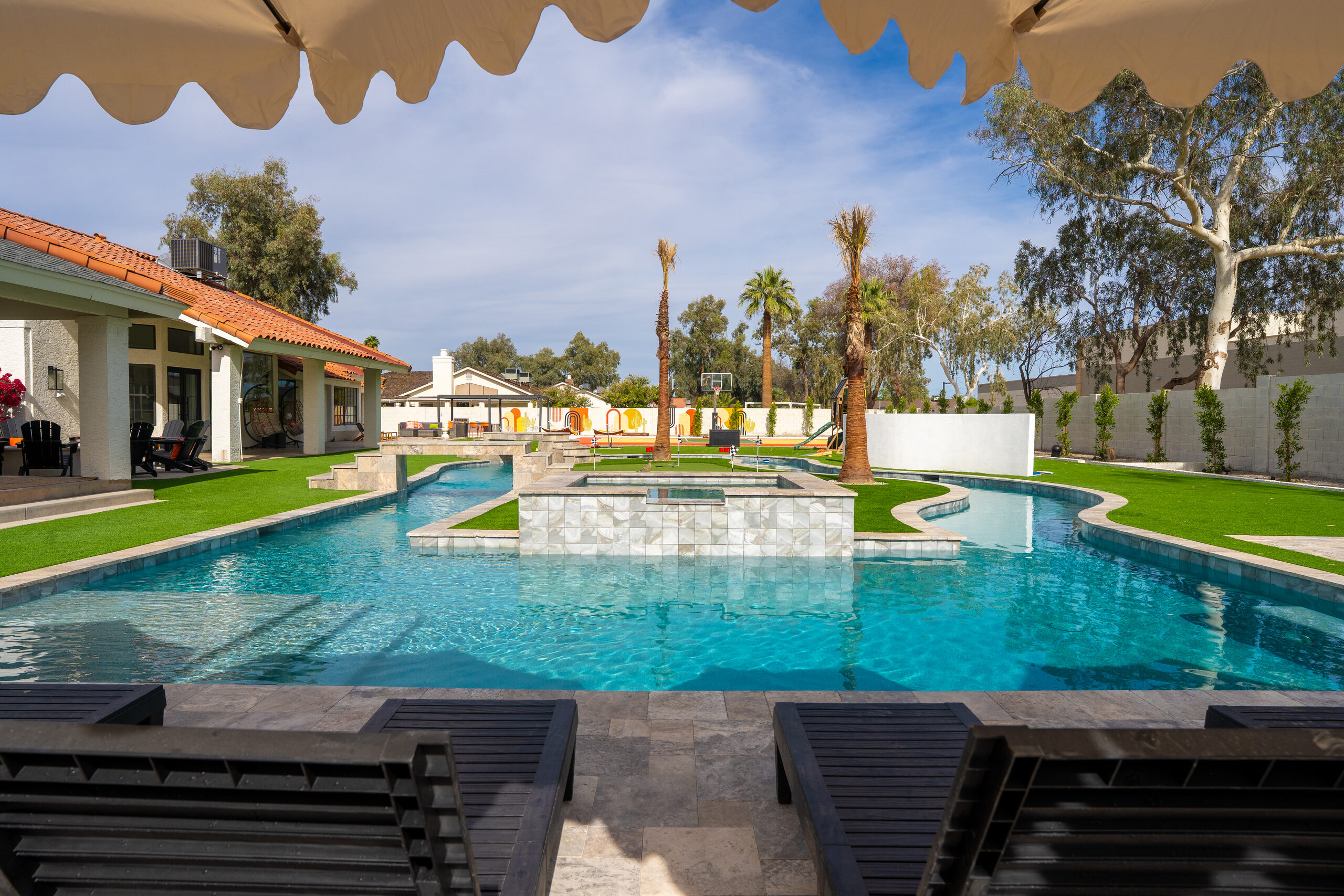 Poolside cabana seating and raised spa in Glendale, AZ