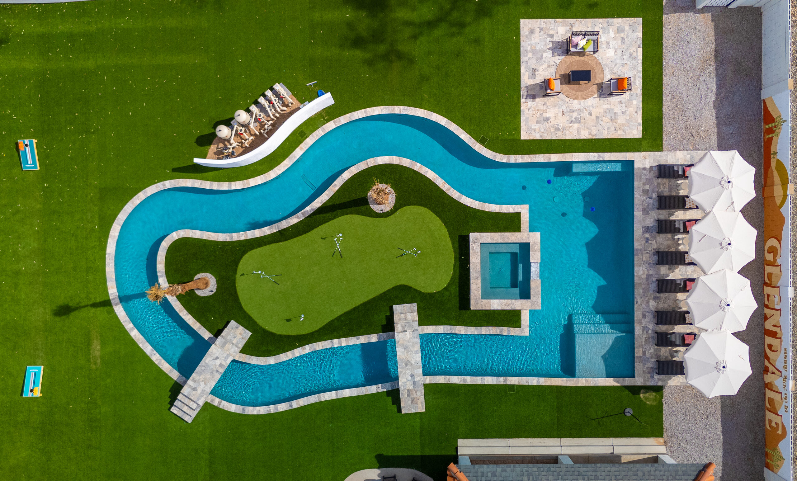 Overhead view of the lazy river looping a putting green in Glendale, AZ