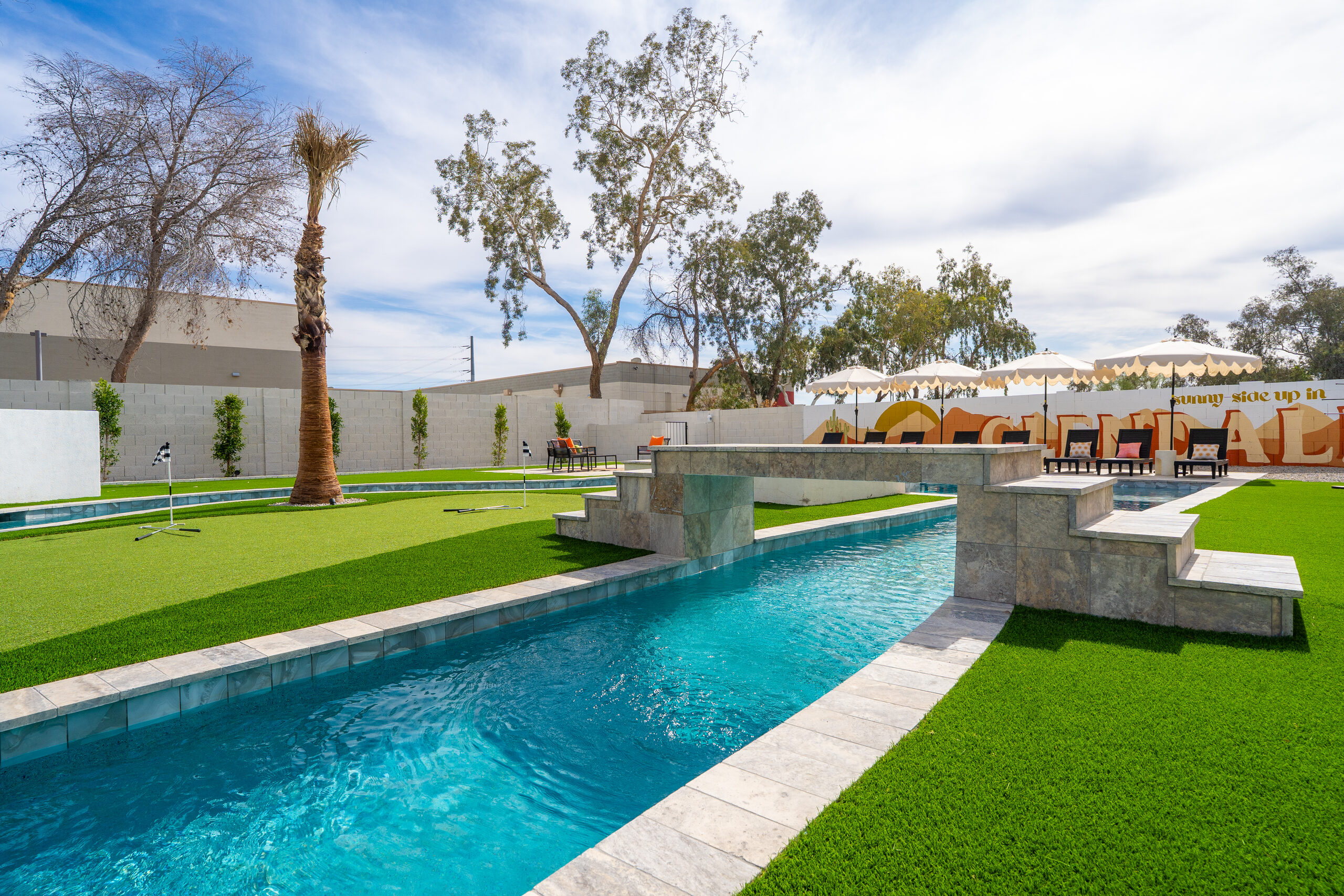 Lazy river and pool with Glendale mural wall in Glendale, AZ