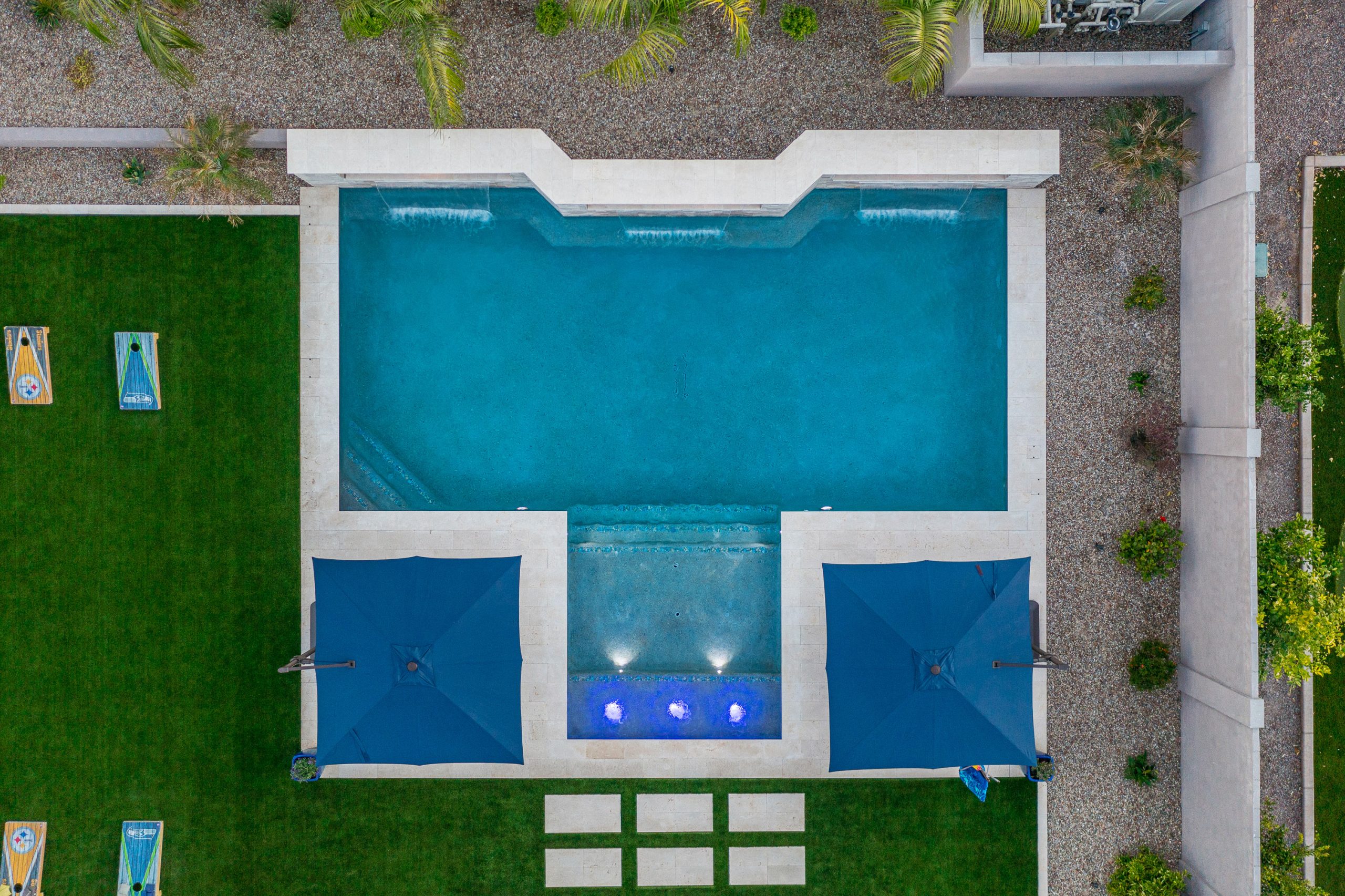 Aerial view of a rectangular pool with sun shelf in Queen Creek, AZ
