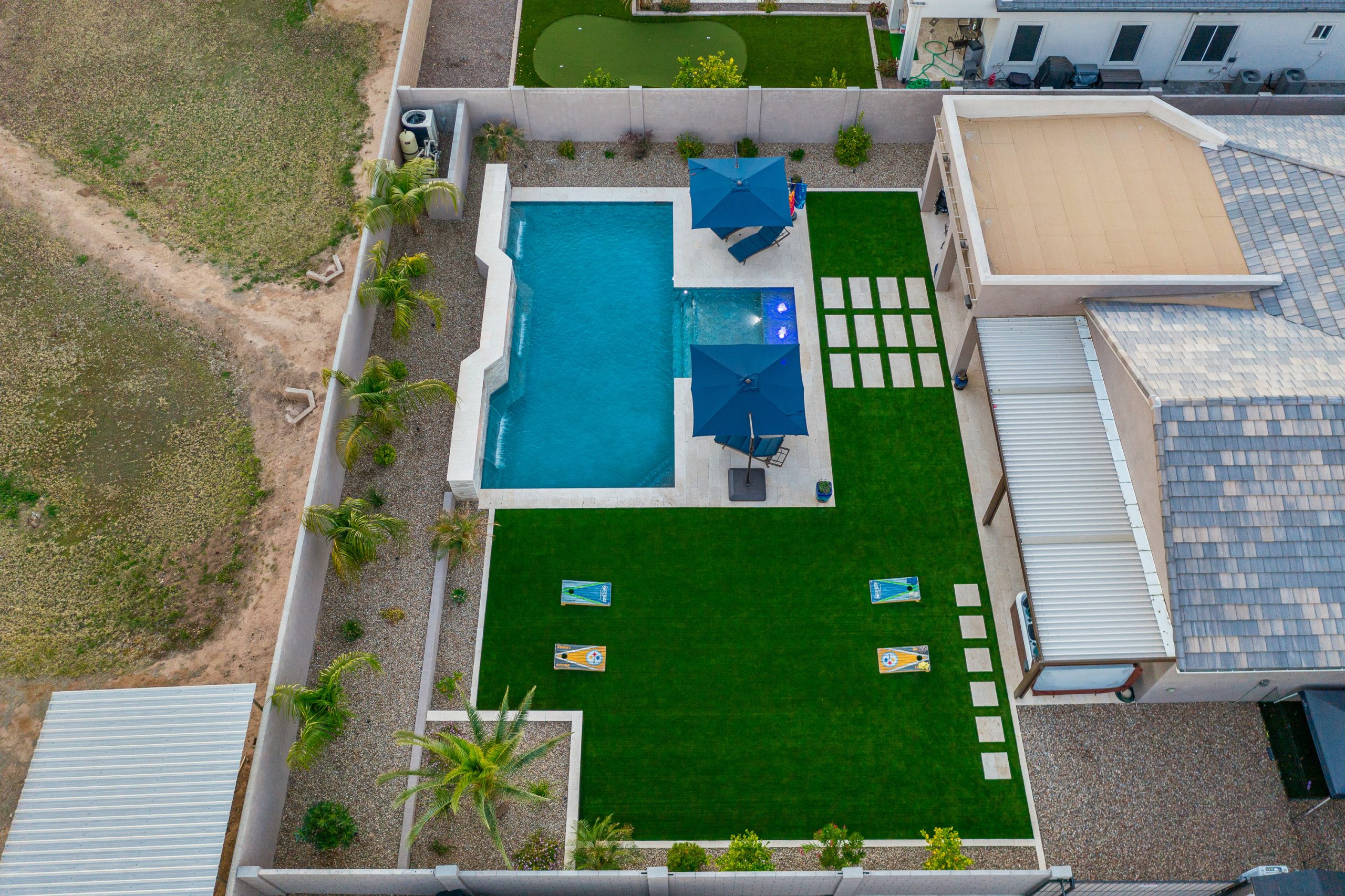 Aerial of a geometric pool and turf lawn in Queen Creek, AZ