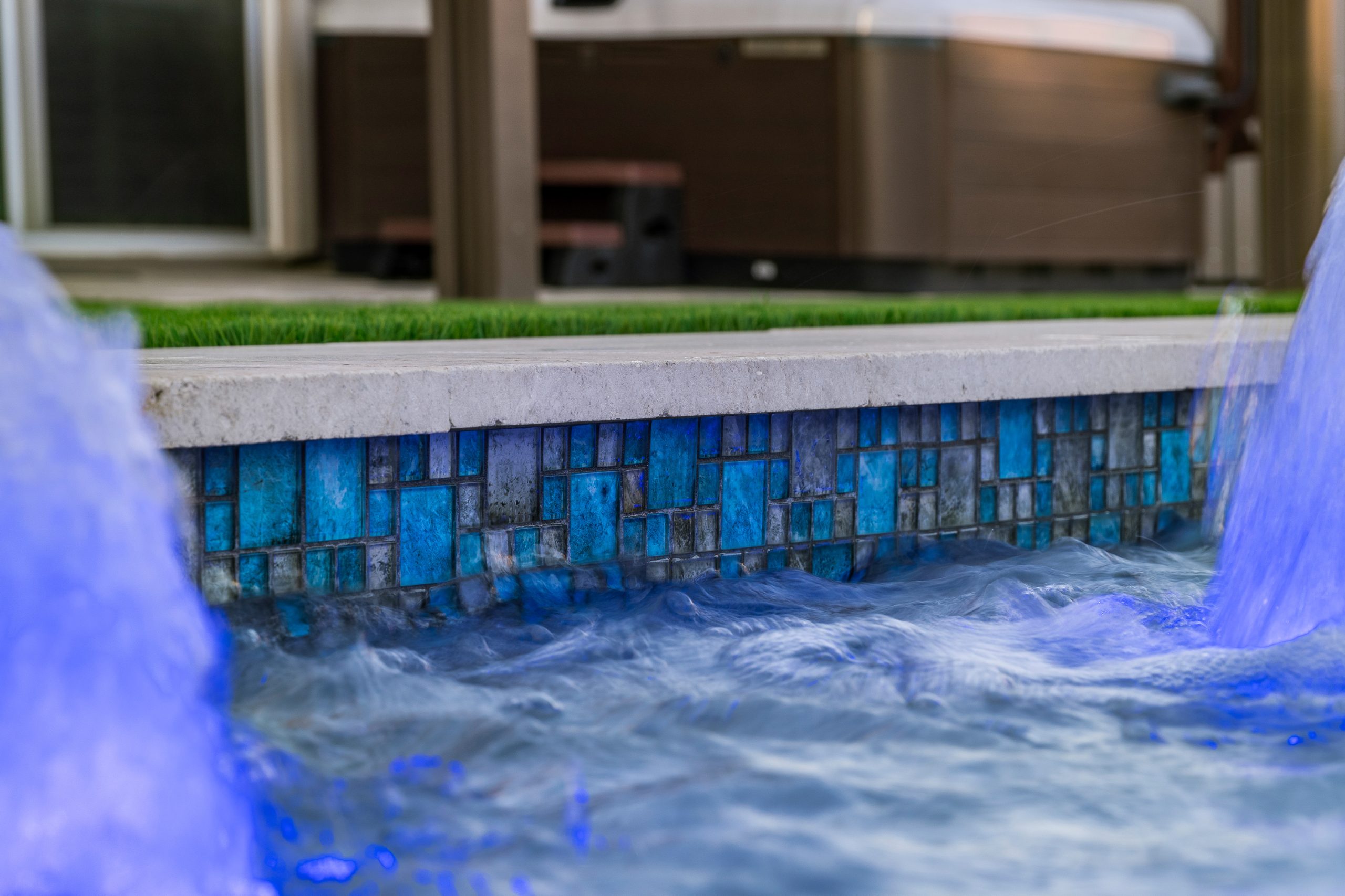 Blue glass mosaic tile and sheer descent detail in Queen Creek, AZ
