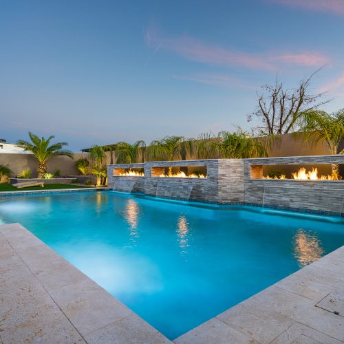 Fire troughs and sheer descents along a pool wall in Queen Creek, AZ