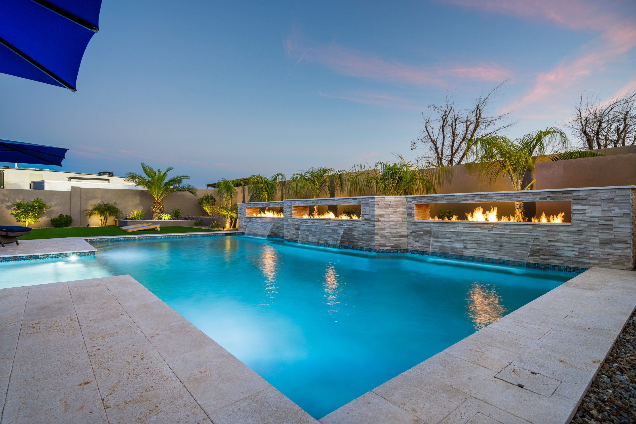Fire troughs and sheer descents along a pool wall in Queen Creek, AZ
