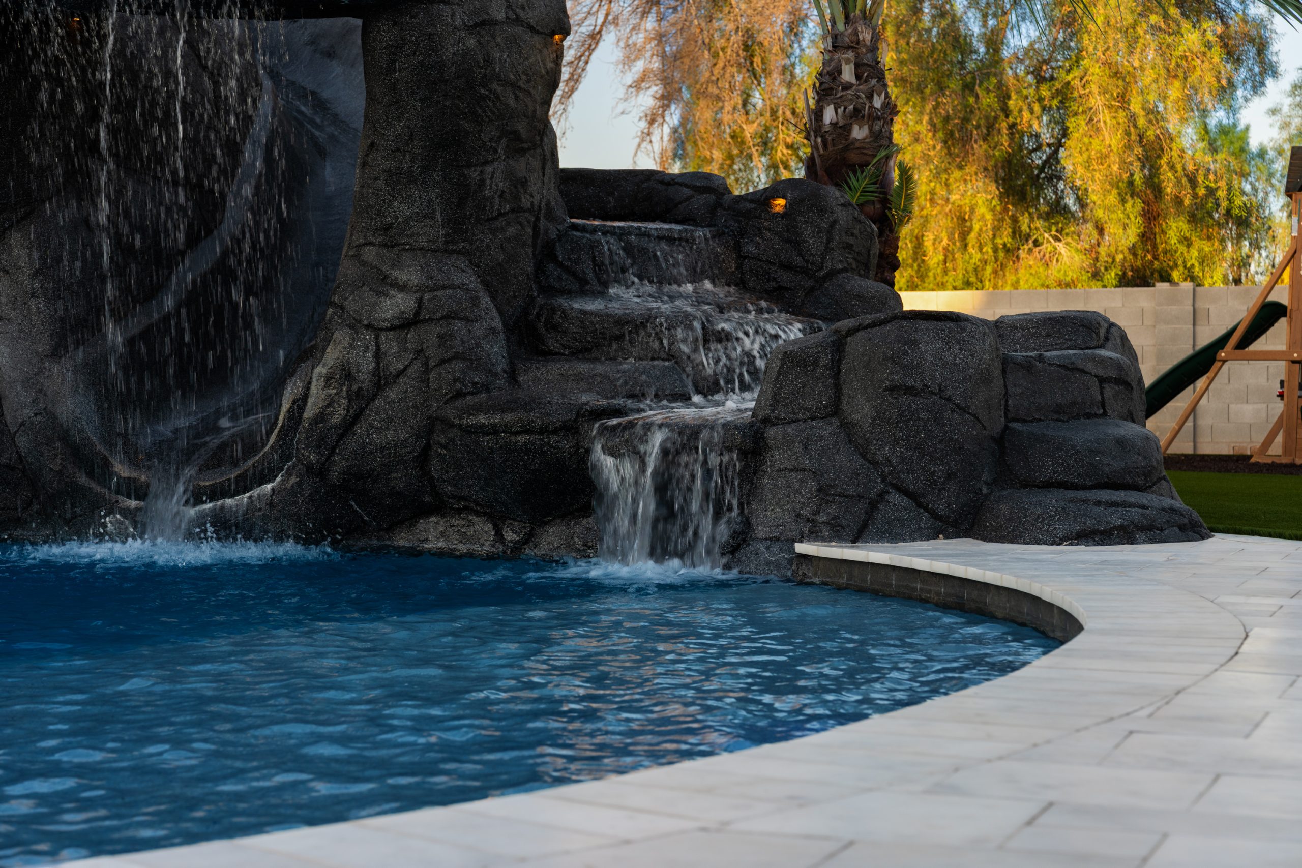 Grotto waterfall feature over a custom pool in Gilbert, AZ