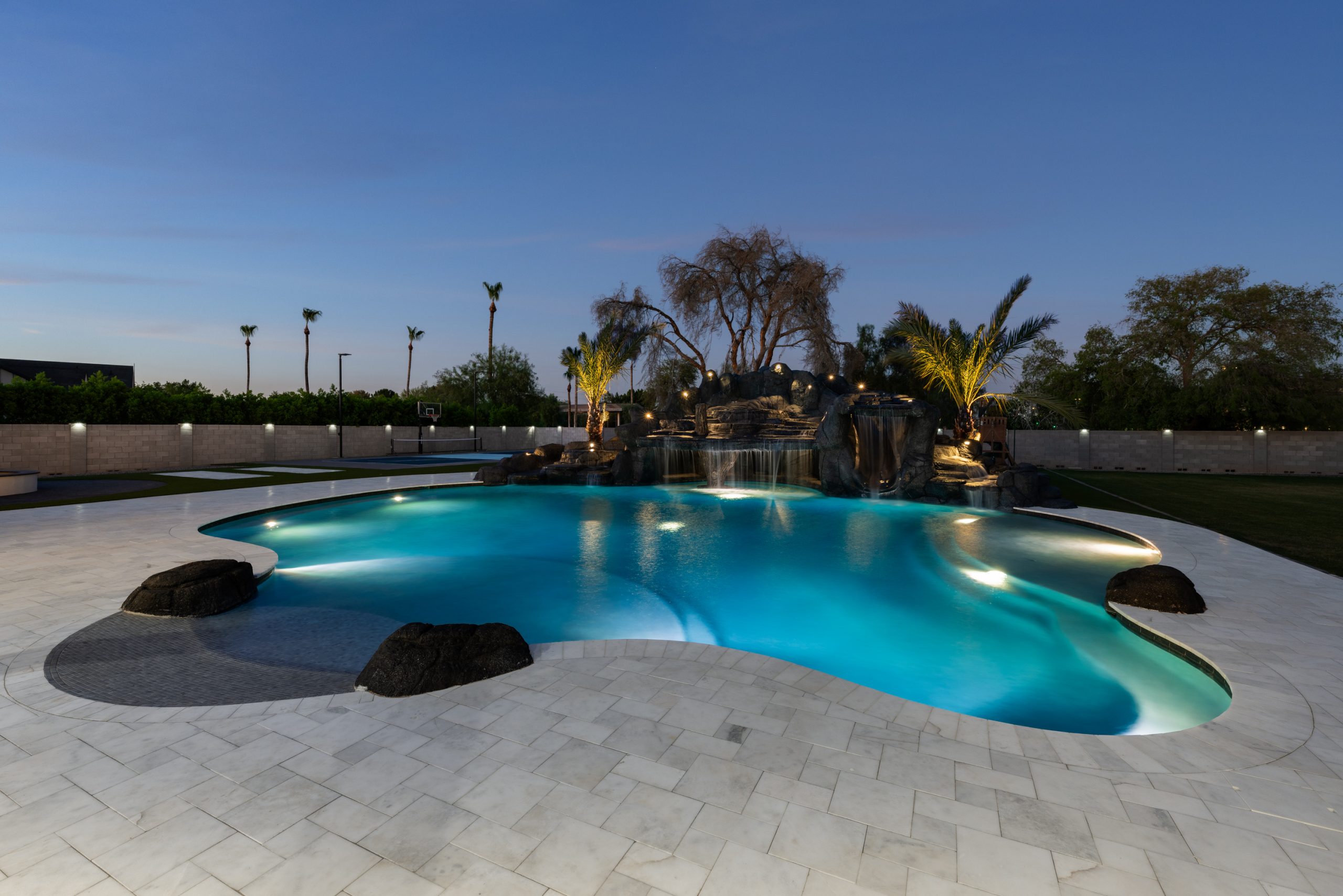 Curved custom pool and landscape lighting in Gilbert, AZ