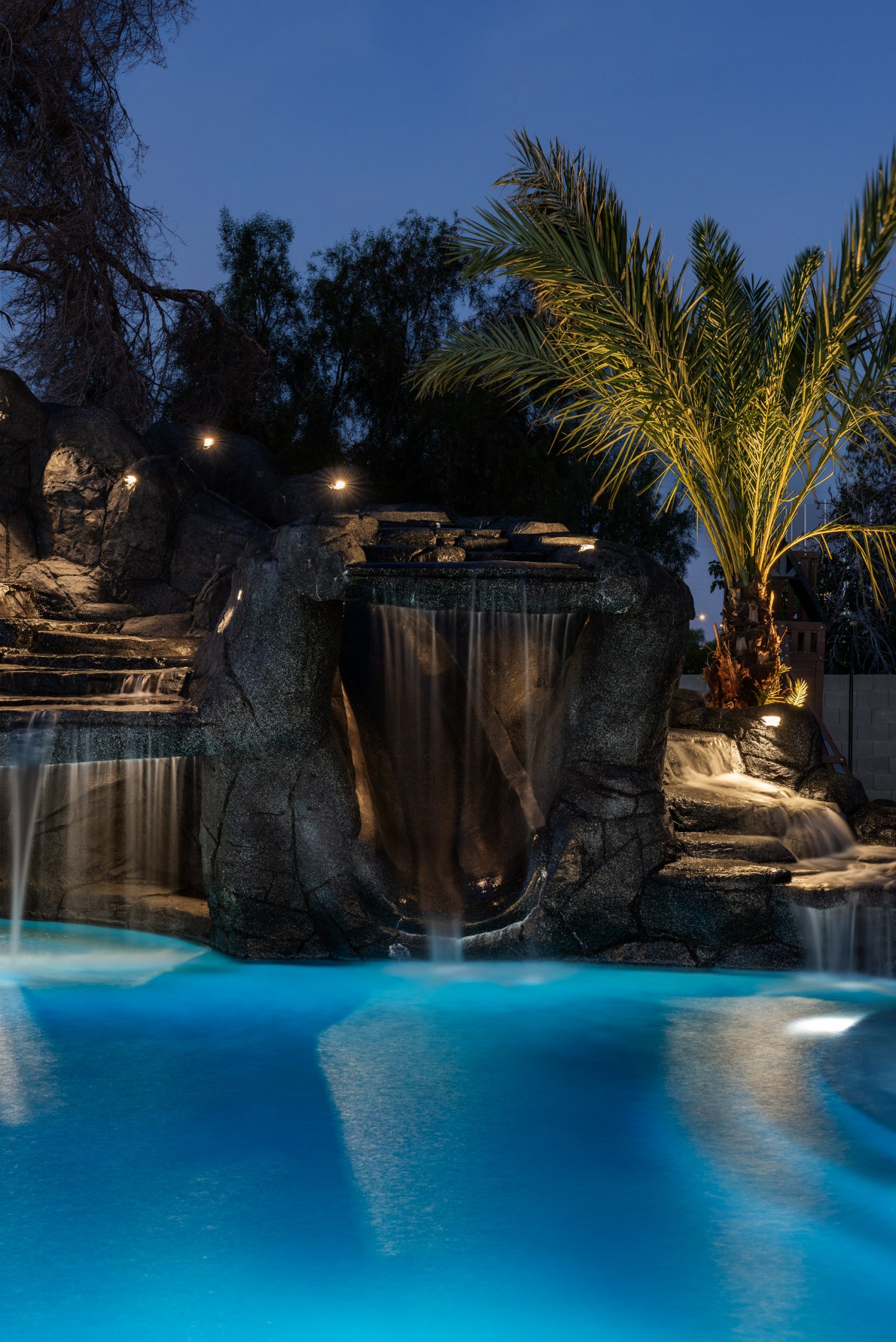 Night view of the grotto waterfall in Gilbert, AZ