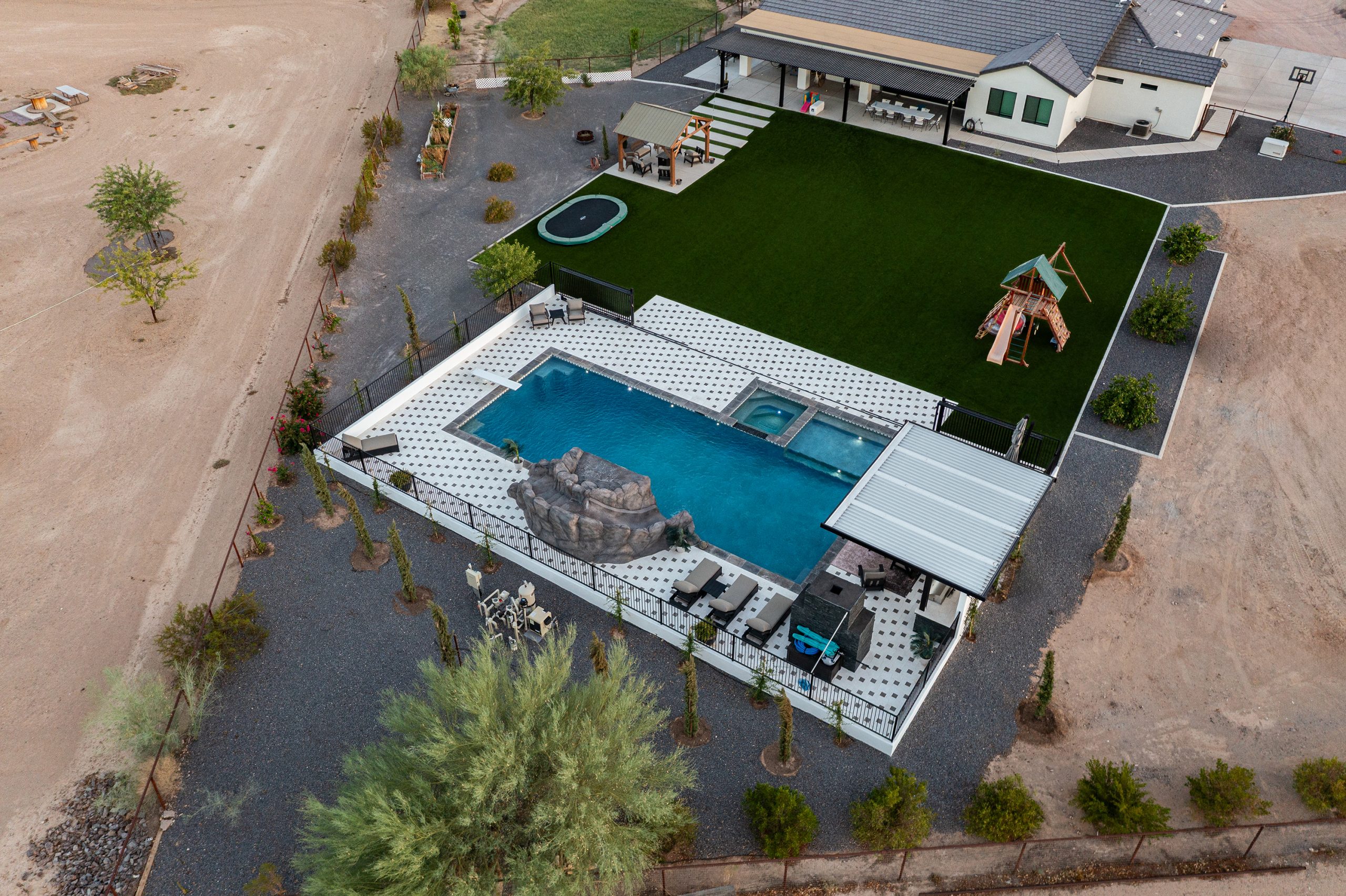 Overhead view of a pool, pergola and outdoor kitchen in San Tan Valley, AZ