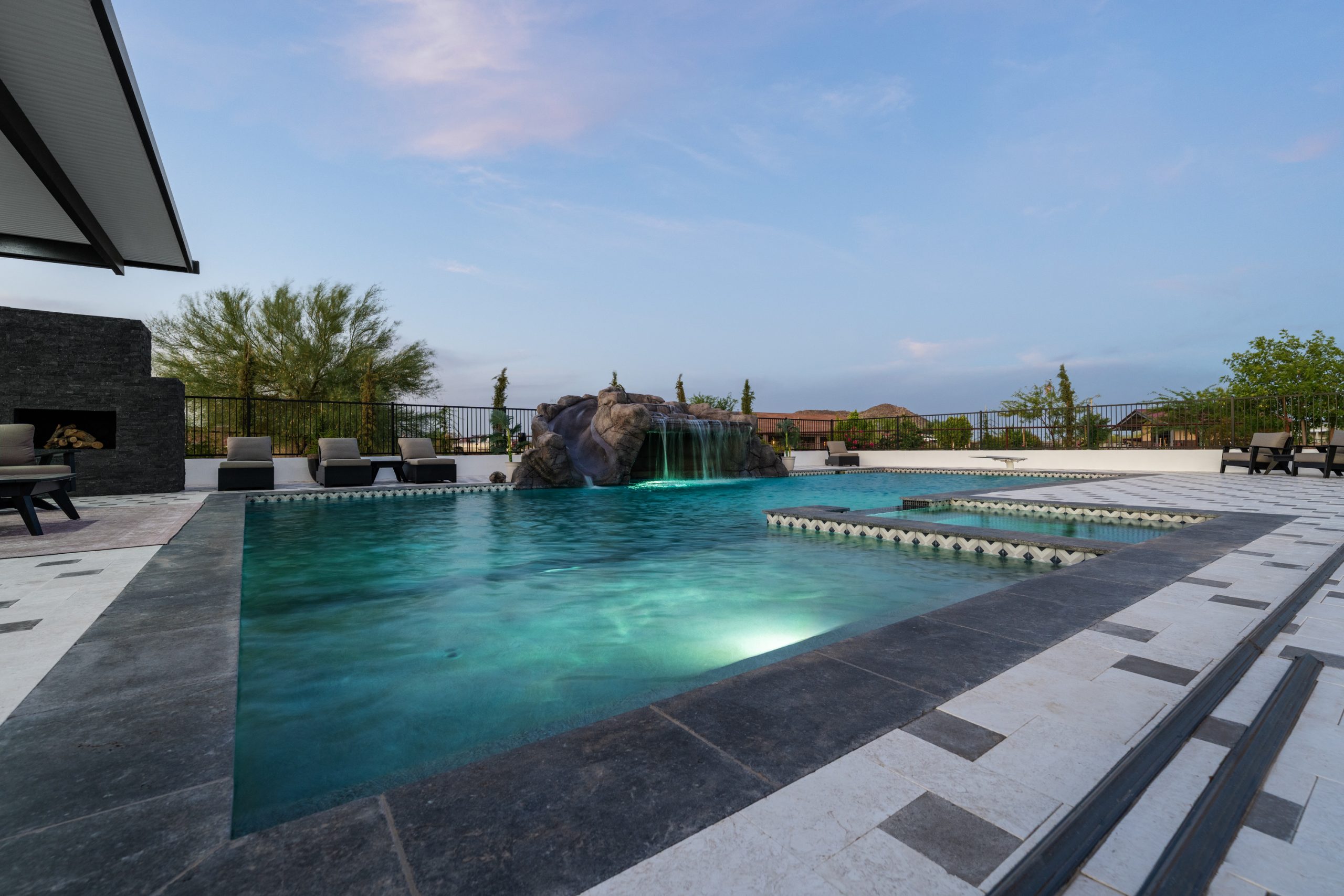 Sunken seating and fireplace at the pool edge in San Tan Valley, AZ