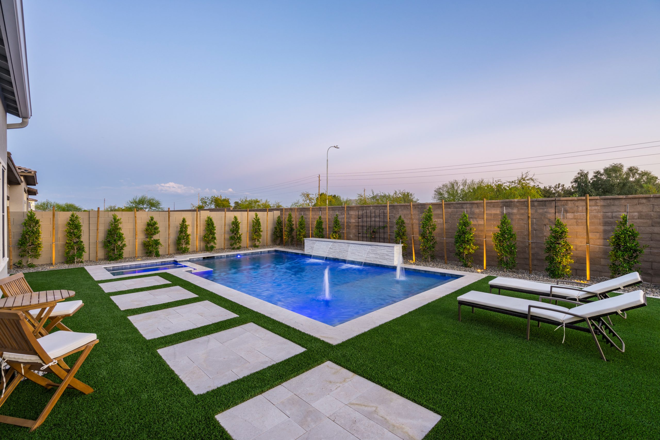 Rectangular pool with deck jets and turf decking in Gilbert, AZ